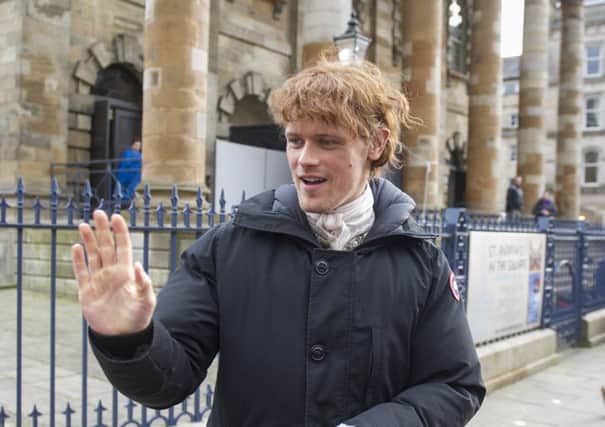 Outlander star Sam Heughan outside the St Andrews-in-the-Square in Glasgow. Picture: John Devlin