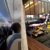 A video filmed shortly after landing shows the cabin in disarray, with debris strewn across the aisle and passengers wearing oxygen masks. 