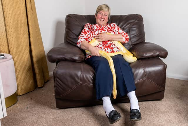 Rosemary Kin,63 with Amun-Ra her nine foot pet Burmese python