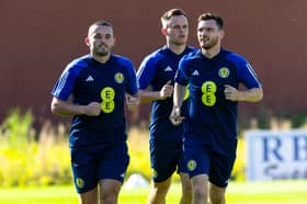 John McGinn, Lawrence Shankland and Andy Robertson prepare for Friday’s opener. Credit SNS 