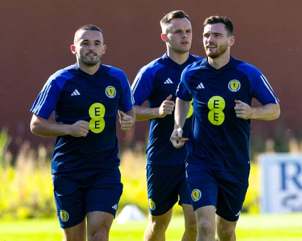 John McGinn, Lawrence Shankland and Andy Robertson prepare for Friday’s opener. Credit SNS 