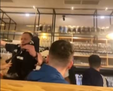 Piper falls off table in pub while entertaining Scotland fans.