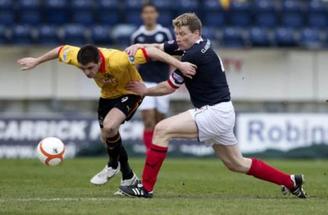 Darren Dods closes down Partick's Kris Doolan. Picture: SNS