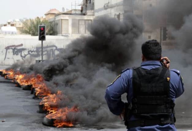 A protest roadblock of burning tyres in the early hours of yesterday in Manama. Picture: Reuters