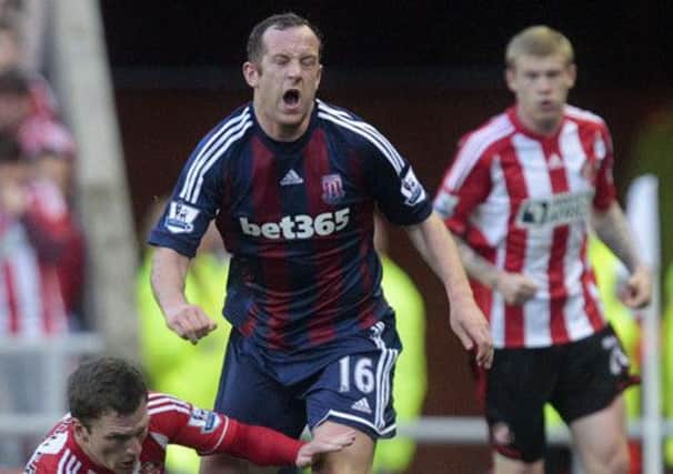 Sundelands Craig Garnder fouls Stoke Citys Scottish midfielder Charlie Adam. Picture: SNS