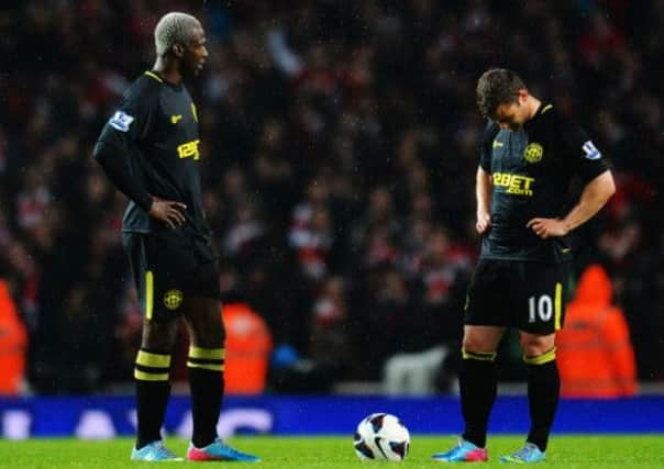 Jean Beausejour and Shaun Maloney during their 4-1 defeat to Arsenal. Picture: Getty