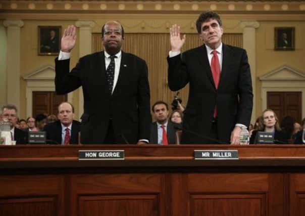 Former IRS chief Steve Miller, right, and treasury colleague J Russell George on Capitol Hill. Picture: Getty