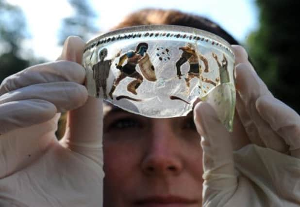 A fragment of Roman glass found on the Vindolanda settlement. Picture: PA