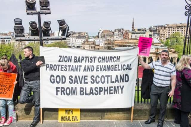 Protesters get their point across over gay ministers during the recent meeting of the Kirks General Assembly.  Picture: Ian Georgeson