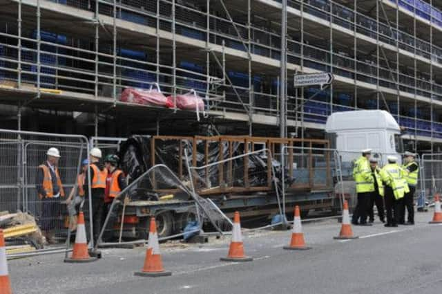 The crane dropped its load onto a car and a lorry. Picture: Esme Allen