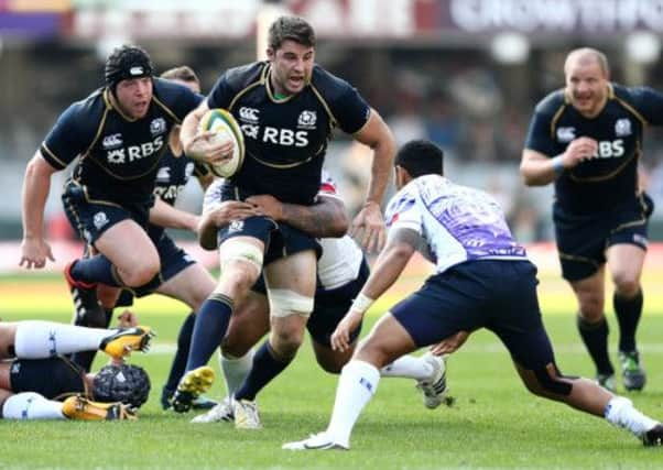 Sean Lamont looks to break a tackle against Samoa. Picture: Getty