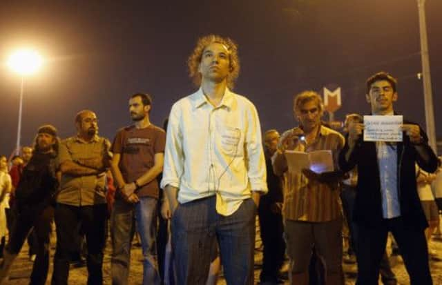 Erdem Gunduz carried out his standing protest in Taksim Square in Istanbul on Monday night. Picture: Marko Djurica/Reuters