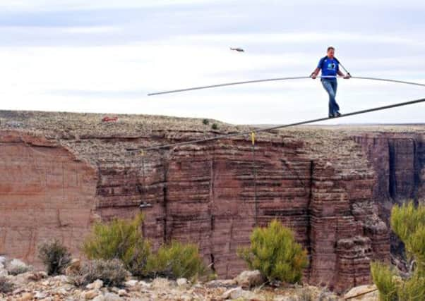 Nik Wallenda near the end of his quarter mile walk over the Little Colorado River Gorge. Picture: AP