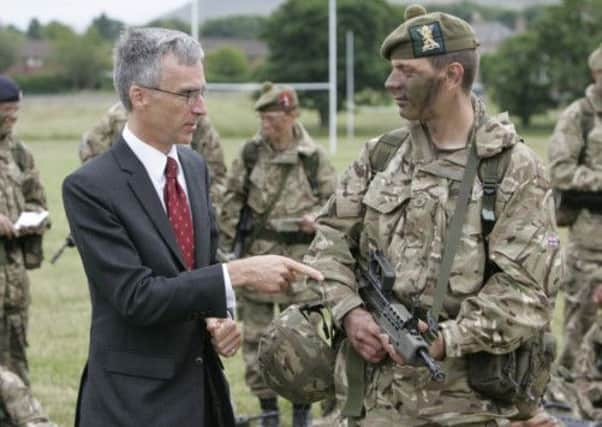 Dr Andrew Murrison talks to Territorial Army members training at Redford Barracks in Edinburgh yesterday/ Picture: Toby Williams