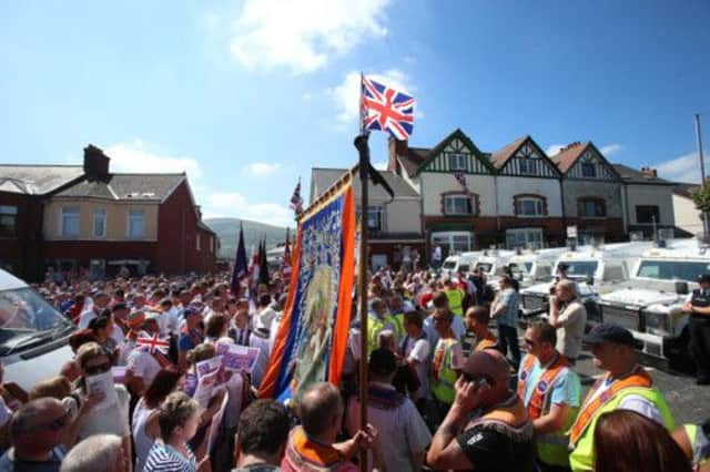 A stand-off with police on Woodvale Road, Belfast, close to the Ardoyne. Picture: PA