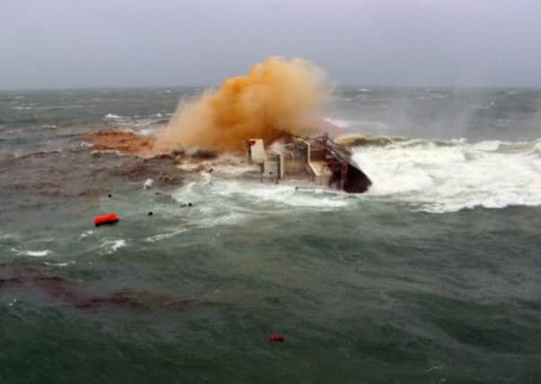 The cargo ship lies on her side before sinking off Hong Kong. The 21 crew members were rescued by helicopters. Picture: Getty