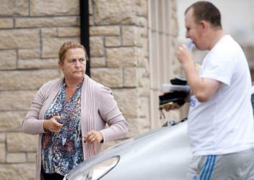 Debra Reid, the mother of arrested teenager Melissa, and her brother Liam outside the family home near Lenzie. Picture: Robert Perry