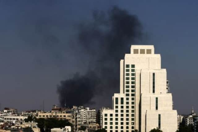 Black columns of smoke rise from heavy shelling in the Jobar neighborhood in East of Damascus, Syria. Picture: AP