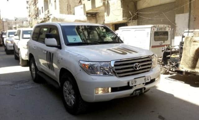 A convoy of U.N. vehicles carrying a team of U.N. chemical weapons experts at one of the sites of an alleged poison gas attack. Picture: Reuters