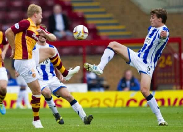 Henri Anier (left) battles for the ball with Kilmarnock's Jackson Irvine. Picture: SNS