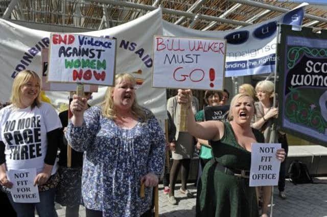 Protesters including NUS Scotland Officer Stacey Devine, gathered outside Holyrood calling for Bill Walker to resign. Picture: Julie Bull