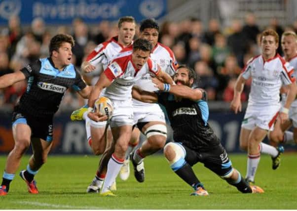 Glasgows Josh Strauss, left, and DTH van der Merwe combine to halt Ulsters David MacIlwaine last night. Picture: Sportsfile