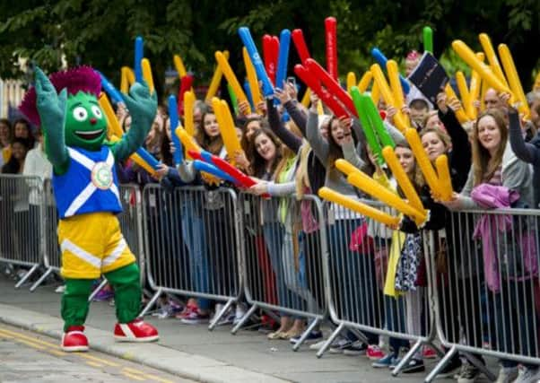 Glasgow 2014 mascot Clyde keeps fans entertained earlier this month. Picture: SNS