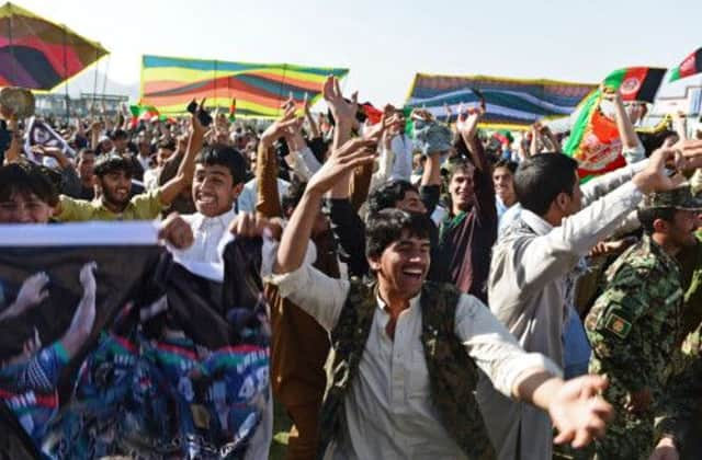 Fans watch the AfghanistanKenya match yesterday on a screen at the International Cricket Stadium in Kabul. Picture: Getty