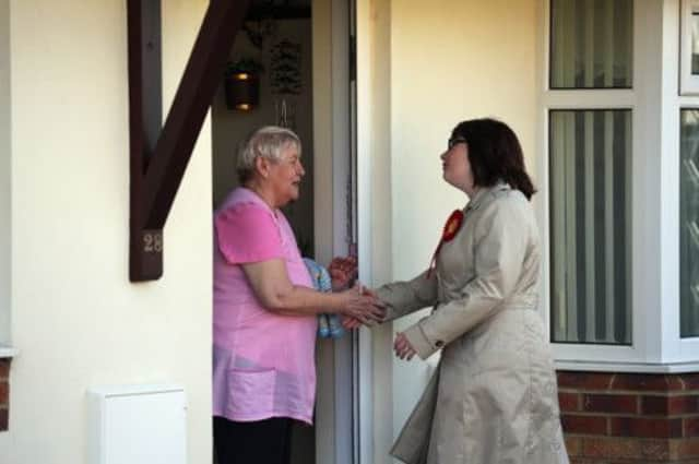 A Labour candidate campaigns door to door  the kind of pavement politics that swims against a tide of cynicism and isolating technology. Picture: Getty