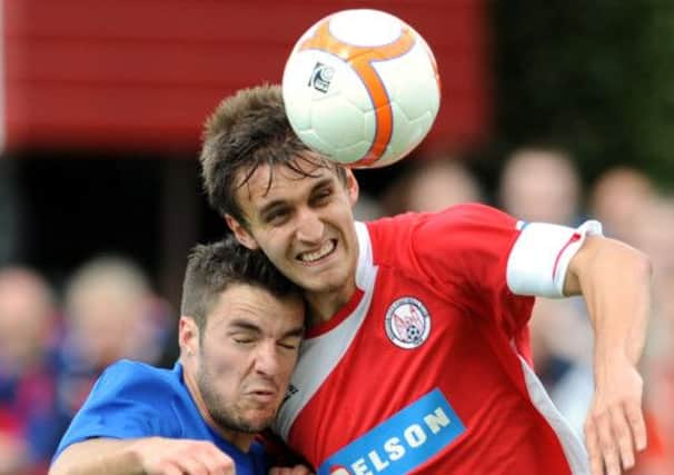 Ewan Moyes, right, locks horns with Rangers Andrew Little on Ramsdens Cup duty. Picture: Jane Barlow