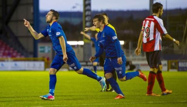 Graeme Shinnie celebrates after scoring ICT's second goal of the game. Picture: SNS