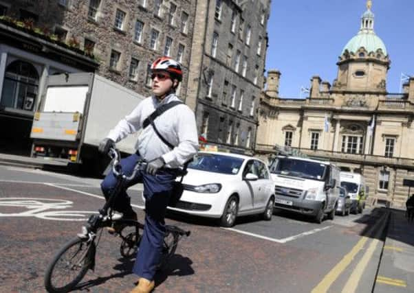 Keith Brown is keen for more people to switch to bikes for travelling to work. Picture: Greg Macvean