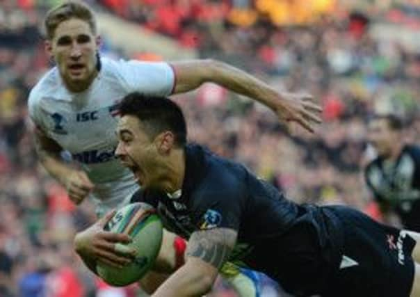 New Zealand's Shaun Johnson scores the winning try with 21 seconds left against England in the Rugby League World Cup semi. Picture: Jamie McDonald