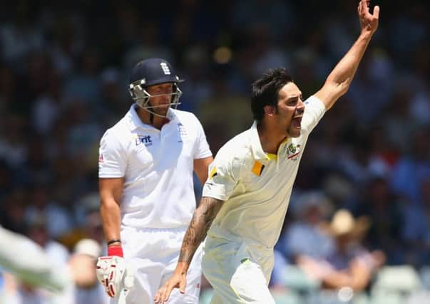 Mitchell Johnson celebrates taking Stuart Broads wicket as Tim Bresnan looks on. Picture: Getty