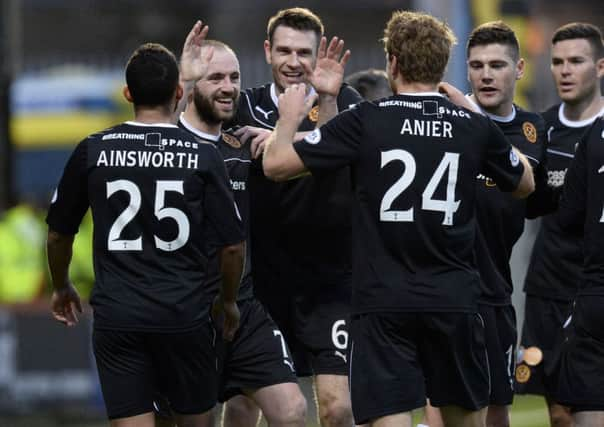 Motherwell's James McFadden is all smiles as he celebrates his goal. Picture: SNS