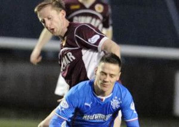 Stenhousemuir's Bryan Hodge brings down Rangers midfielder Ian Black. Picture: Gary Hutchison