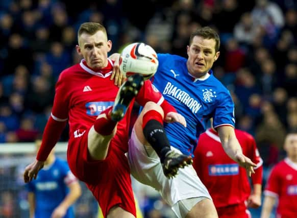 Brechin Citys Graham May and Rangers Jon Daly battle for possession at Ibrox. Picture: SNS