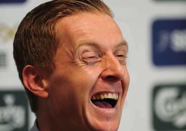 Garry Monk, Swansea Citys caretaker manager following Michael Laudrups exit, raises a smile as he faces the media. Picture: Getty