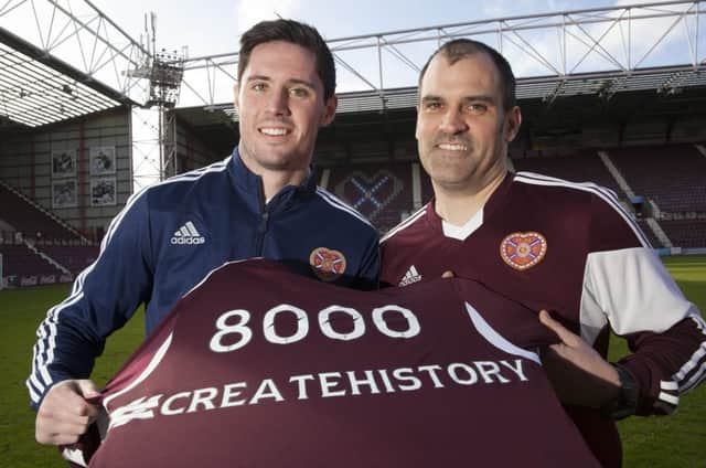 Dylan McGowan, left, congratulates fan Derek Shade on becoming the 8,000th contributor. Picture: SNS