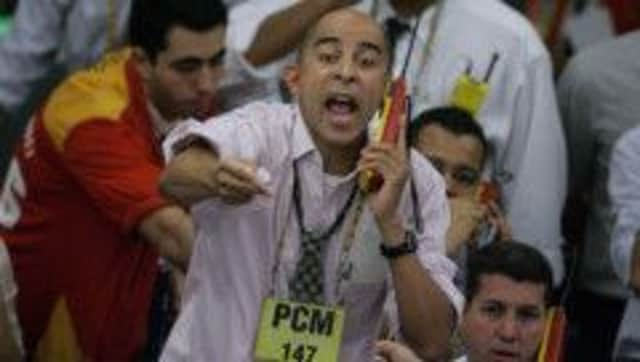 A stock trader gives instructions from the exchange floor. Picture: Getty