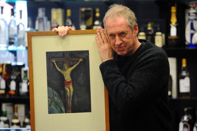 Peter Howson with Christ On The Cross, which he painted at the age of six. Picture: Robert Perry/TSPL