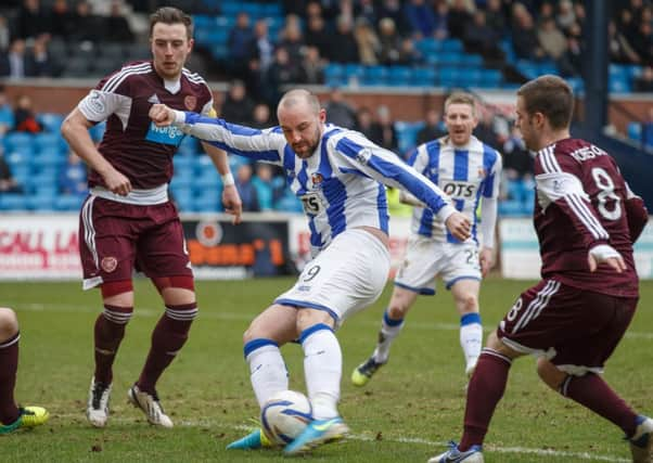 Striker Kirs Boyd smashing in Kilmarnock's third goal against Hearts. Picture: Steve Welsh