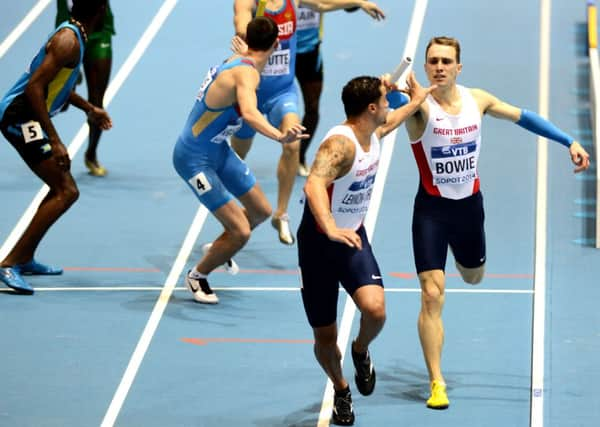 Jamie Bowie hands the baton to Luke LennonFord as Britain claimed silver in Poland. Picture: AFP/Getty