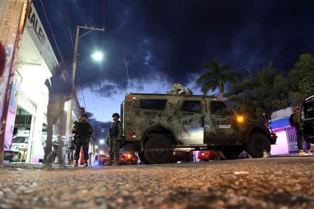 Marines and soldiers guard the mortuary where the alleged corpse of Nazario Moreno lies. Picture: AFP/Getty