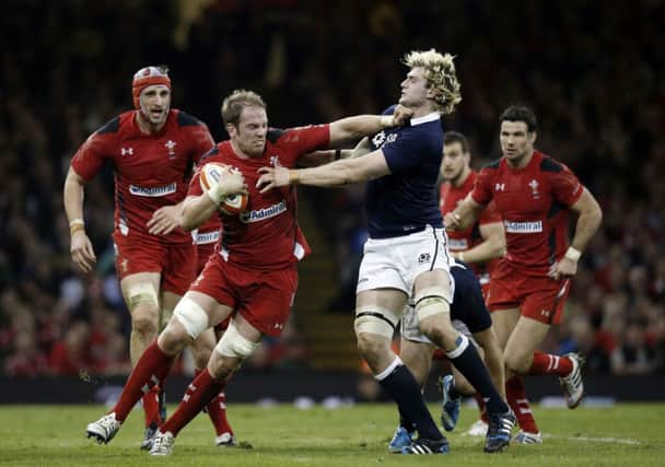 Wales' Lock Alun Wyn Jones  hands off Scotland lock Richie Gray. Picture: Getty