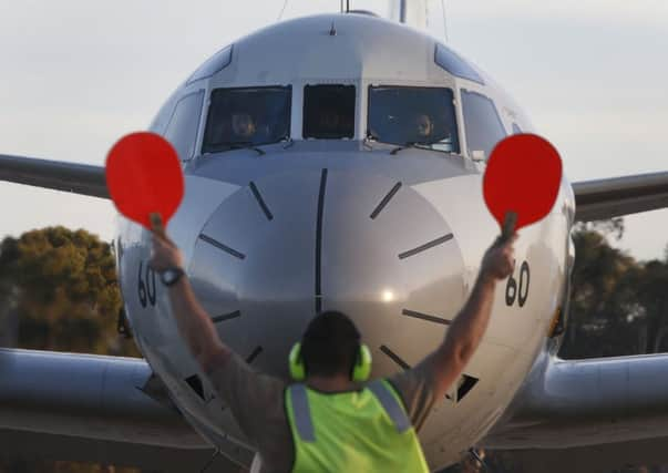 A Japanese Air Force P3 aircraft lands at an Australian base in to join the search. Pictures: Getty