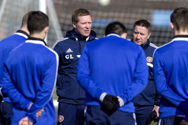 Hearts manager Gary Locke speaks to his players during training. Picture: SNS