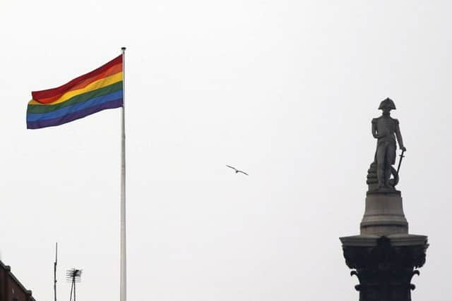 A rainbow flag flies over a building next to Nelson's Column monument in Trafalgar Square, central London. Picture: AP