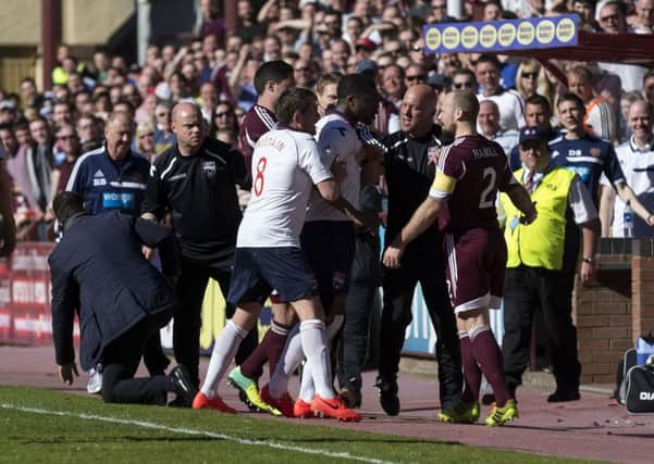 Jamie Hamill (right) is involved in an incident with County manager Derek Adams. Picture: SNS