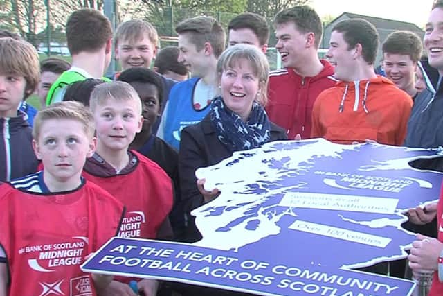 Shona Robison meets children taking part in a five-a-side football initiative in Dundee. Picture: SNS/Material